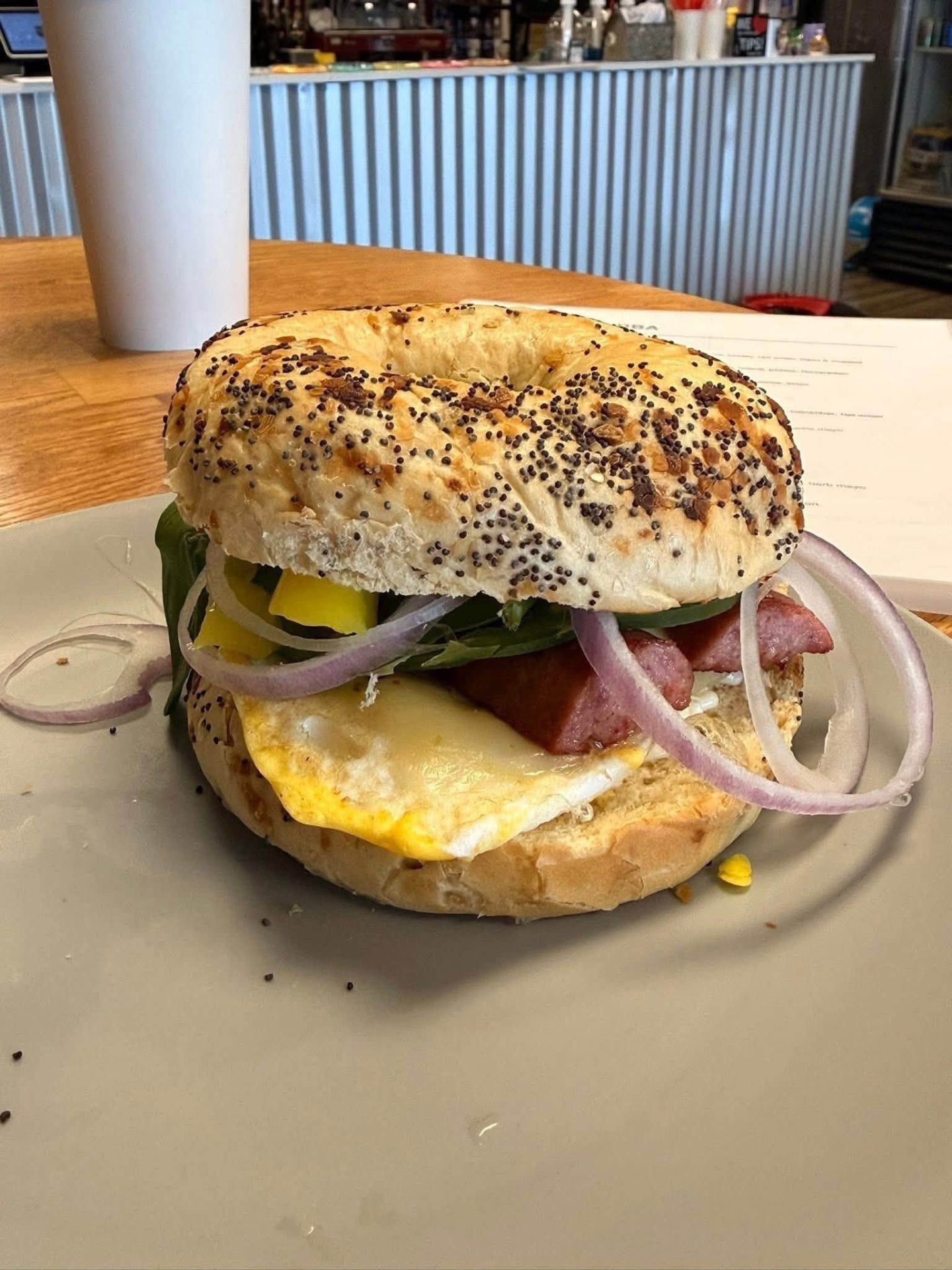 Bagel breakfast sandwich with egg, cheese and reindeer sausage